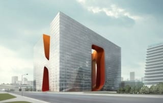 Modern Dubai hotel with distinctive orange interior cutouts and glass facade.